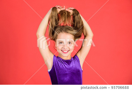 How to make tidy hairstyle for kid. Ballroom latin dance hairstyles. Kid girl with long hair wear dress on red background. Things you need know about ballroom dance hairstyle. Hairstyle for dancer 93706688