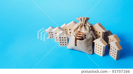 Philippine peso money bag surrounded by houses. Buying apartments. Mortgage loan. Real estate. Budget and funding. Construction industry. Property insurance. Housing appraisal. Valuation estimation 93707166