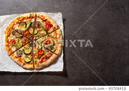 Vegetarian pizza with zucchini, tomato, peppers and mushrooms Vegetarian pizza with zucchini, tomato, peppers and mushrooms 93708418
