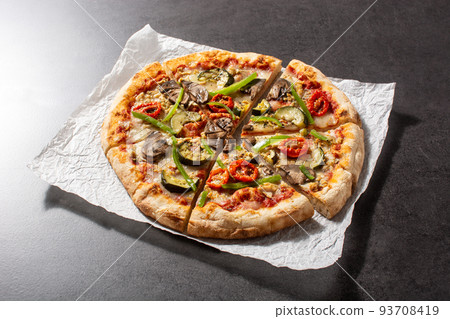 Vegetarian pizza with zucchini, tomato, peppers and mushrooms Vegetarian pizza with zucchini, tomato, peppers and mushrooms 93708419