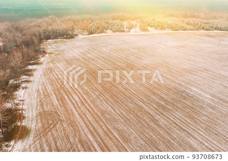 Aerial view autumn field landscape with trails lines. Top view of empty clean field in late autumn day. Drone view bird's eye view. High attitude in autumn season 93708673