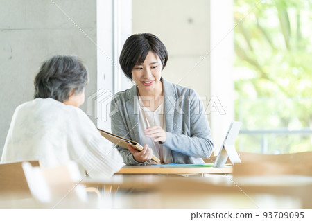 Woman in a wheelchair Business woman A woman in a wheelchair talking on a smartphone 93709095