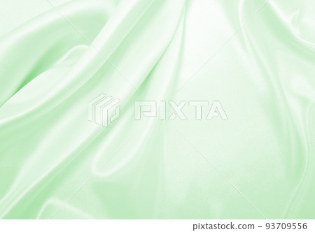 Smooth elegant green silk or satin luxury cloth texture as abstract background. Luxurious background design 93709556