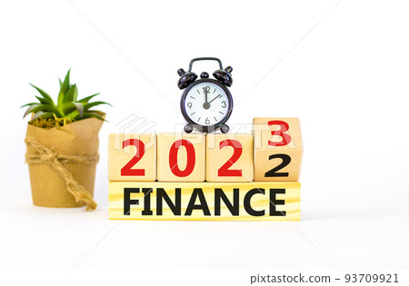 Planning 2023 finance new year symbol. Turned a wooden cube and changes words Finance 2022 to Finance 2023. Beautiful white background, copy space. Business 2023 finance new year concept. Planning 2023 finance new year symbol. Turned a wooden cube and changes words Finance 2022 to Finance 2023. Beautiful white background, copy space. Business 2023 finance new year concept. 93709921