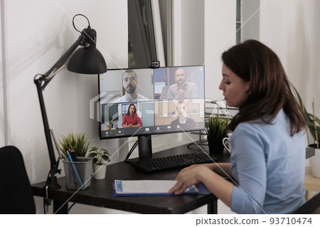 Coworkers talking on videocall, discussing startup project strategy, online business presentation. Employee chatting with colleagues on videoconference, remote team brainstorming on teleconference 93710474