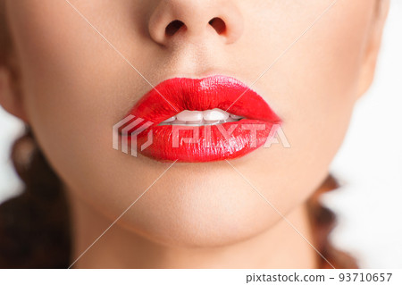 Close-up Beautiful lips. Sexy plump lips which red lipstick. 93710657