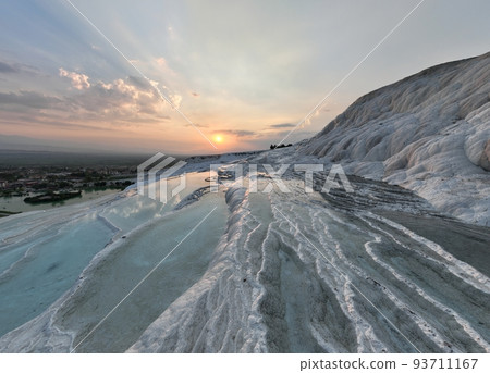 Pamukkale Travertines Cinematic Aerial Drone footage. Turkish famous white thermal bath with healthy clean water in a beautiful sunset. Pamukkale Travertines Cinematic Aerial Drone footage. Turkish famous white thermal bath with healthy clean water in a beautiful sunset. 93711167