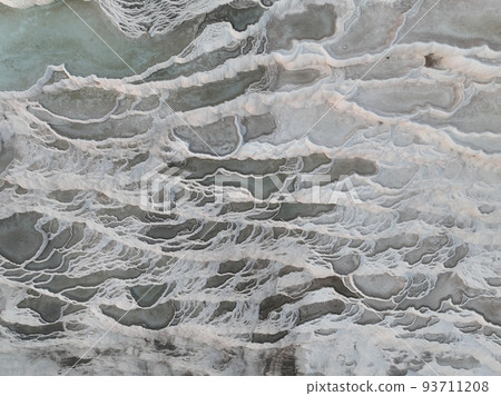 Pamukkale Travertines Cinematic Aerial Drone footage. Turkish famous white thermal bath with healthy clean water in a beautiful sunset.  93711208