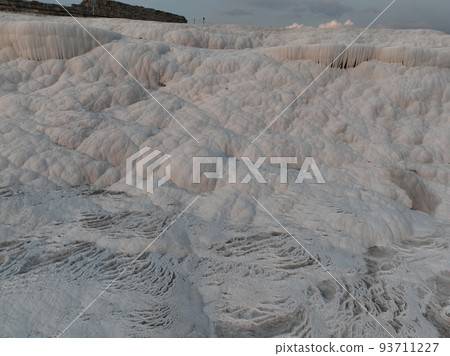 Pamukkale Travertines Cinematic Aerial Drone footage. Turkish famous white thermal bath with healthy clean water in a beautiful sunset.  93711227