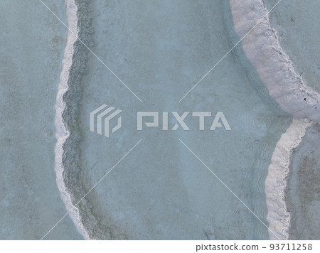 Pamukkale Travertines Cinematic Aerial Drone footage. Turkish famous white thermal bath with healthy clean water in a beautiful sunset.  93711258