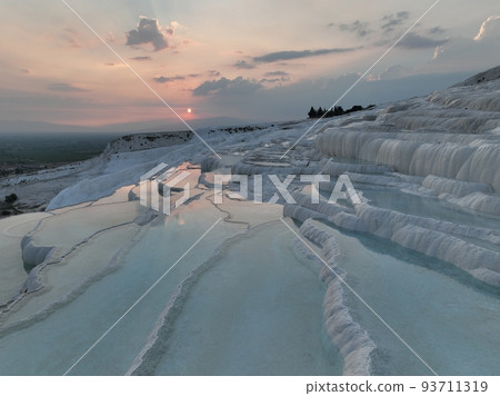 Pamukkale Travertines Cinematic Aerial Drone footage. Turkish famous white thermal bath with healthy clean water in a beautiful sunset. Pamukkale Travertines Cinematic Aerial Drone footage. Turkish famous white thermal bath with healthy clean water in a beautiful sunset. 93711319