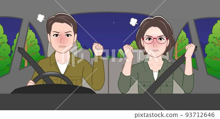 A man and a woman are riding in a car at night 93712646