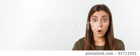 Close-up portrait of surprised beautiful girl holding her head in amazement and open-mouthed. Over white background Close-up portrait of surprised beautiful girl holding her head in amazement and open-mouthed. Over white background 93713591