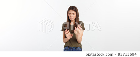 Isolated shot of speechless concerned shocked and angry woman, expressing silence and misconceptions, frightened. Isolated over grey background Isolated shot of speechless concerned shocked and angry woman, expressing silence and misconceptions, frightened. Isolated over grey background 93713694