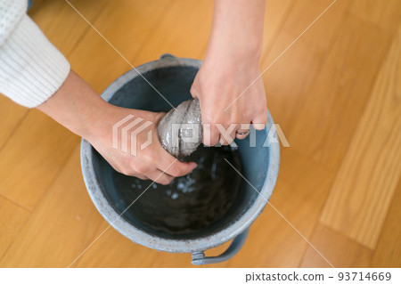 Women focusing on cloth Women focusing on cloth 93714669