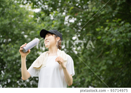 A woman rehydrating A woman rehydrating 93714975