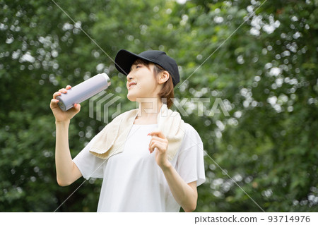 A woman rehydrating A woman rehydrating 93714976
