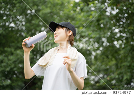 A woman rehydrating A woman rehydrating 93714977