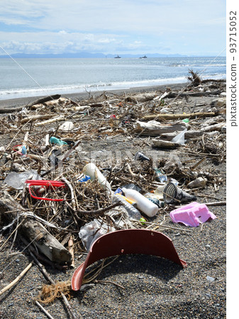 A lot of drifting garbage washed up on the beach beach 93715052