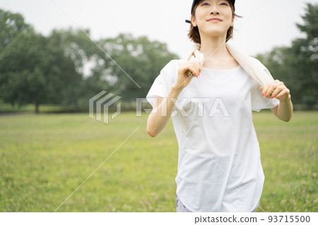 A woman jogging in the park 93715500
