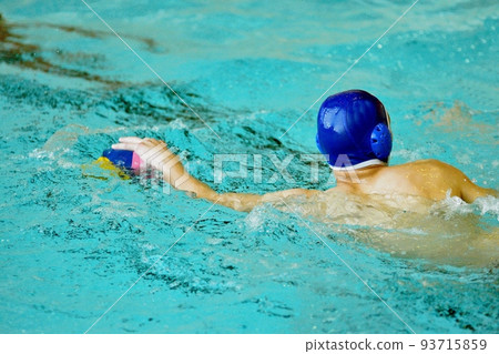 Young men play water polo 93715859