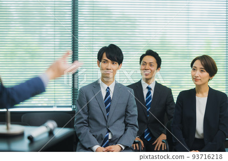 A man with gray hair giving a speech A man with gray hair giving a speech 93716218