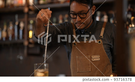 Night club concept of 4k Resolution. A bartender is mixing drinks for customers in a restaurant. A group of specialized clubs that sell alcoholic beverages. Night club concept of 4k Resolution. A bartender is mixing drinks for customers in a restaurant. A group of specialized clubs that sell alcoholic beverages. 93716378