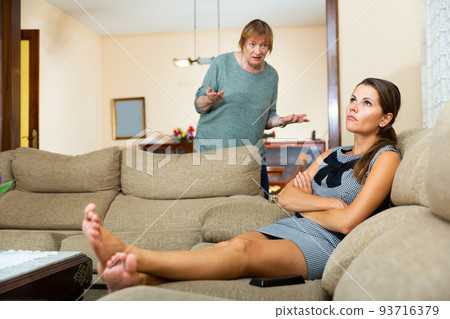 Mature female scolding her upset daughter Mature female scolding her upset daughter 93716379