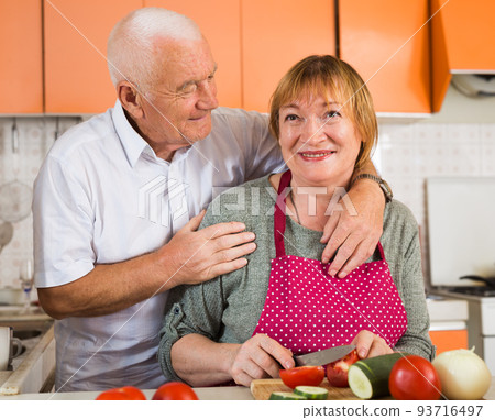 Happy aged couple cooking 93716497
