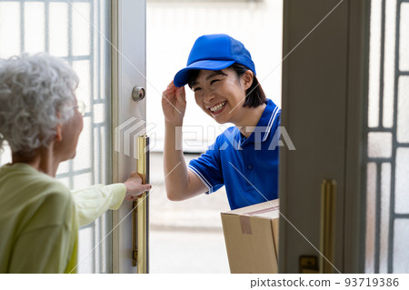 Young woman delivering luggage 93719386