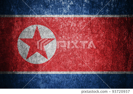 Closeup of grunge North Korean flag. Dirty North Korea flag on a metal surfac 93720937