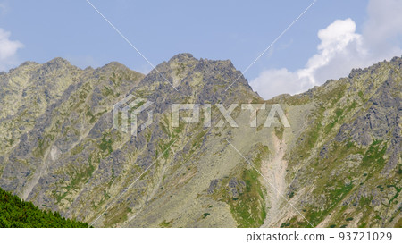 Hot summer day. Mountain landscape with the huge rocky slopes of the High Tatras, Slovakia Hot summer day. Mountain landscape with the huge rocky slopes of the High Tatras, Slovakia 93721029