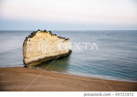 Rock formations near beach and seagulls Rock formations near beach and seagulls 93721972
