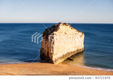 Rock formations near beach and seagulls. Praia, Portugal Rock formations near beach and seagulls. Praia, Portugal 93721976