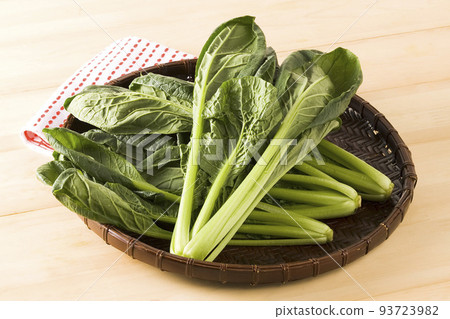 Japanese mustard spinach served in a colander Japanese mustard spinach served in a colander 93723982