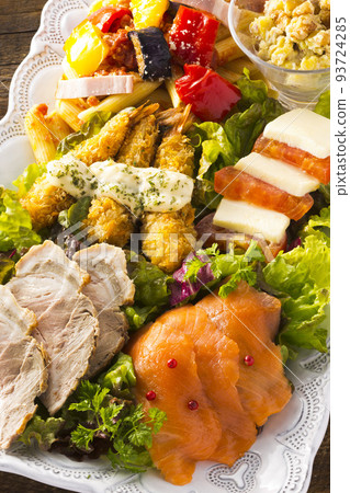 hors d'oeuvres served on a plate 93724285
