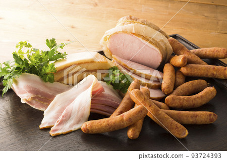 Image of ham, bacon and sausage on a tray 93724393
