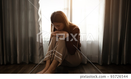 woman sit Depression Standing by window and anxiety Copy space. . 93726544