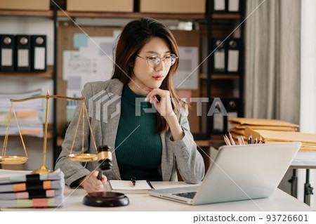 Beautiful asian woman lawyer working and gavel, tablet, laptop in front, Advice justice and law concept. Beautiful asian woman lawyer working and gavel, tablet, laptop in front, Advice justice and law concept. 93726601