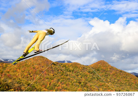 Autumn leaves and ski jumper 93726867