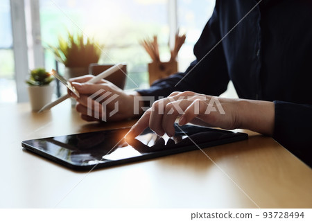 Online payment, Young Women's using tablet and hand holding cradit card for online shopping Online payment, Young Women's using tablet and hand holding cradit card for online shopping 93728494