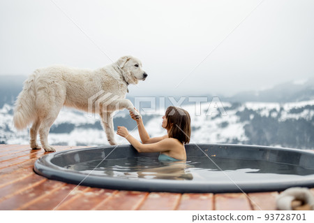 Woman rest with a dog at mountains 93728701