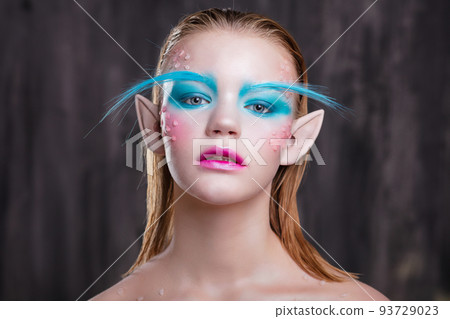 Young lovely girl with creative makeup 93729023