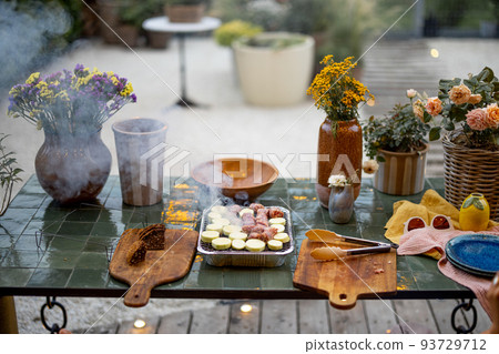 Cooking food on disposable grill at backyard 93729712