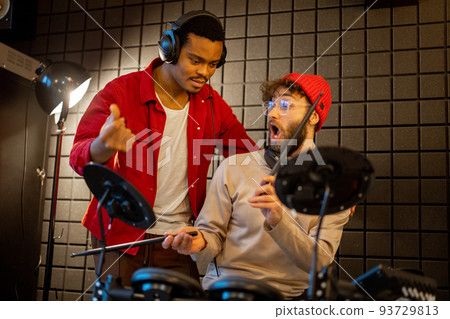 Men playing electric drums at home sstudio Men playing electric drums at home sstudio 93729813