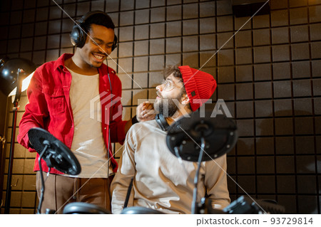 Men playing electric drums at home sstudio 93729814