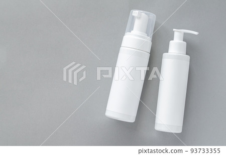 Mock-up of white plastic cosmetics bottles with skincare Mock-up of white plastic cosmetics bottles with skincare 93733355