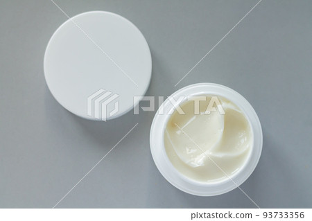 Container of beauty treatment cream with cap background Container of beauty treatment cream with cap background 93733356