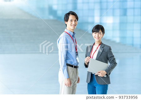 Business person standing in the aisle. Business person standing in the aisle. 93733956