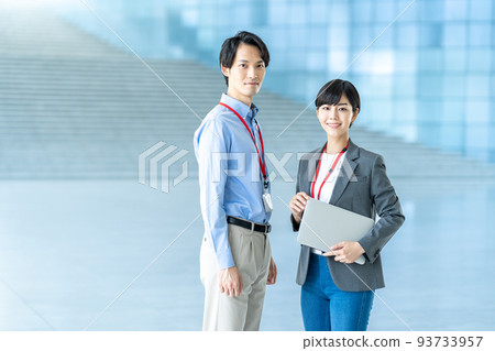 Business person standing in the aisle. Business person standing in the aisle. 93733957